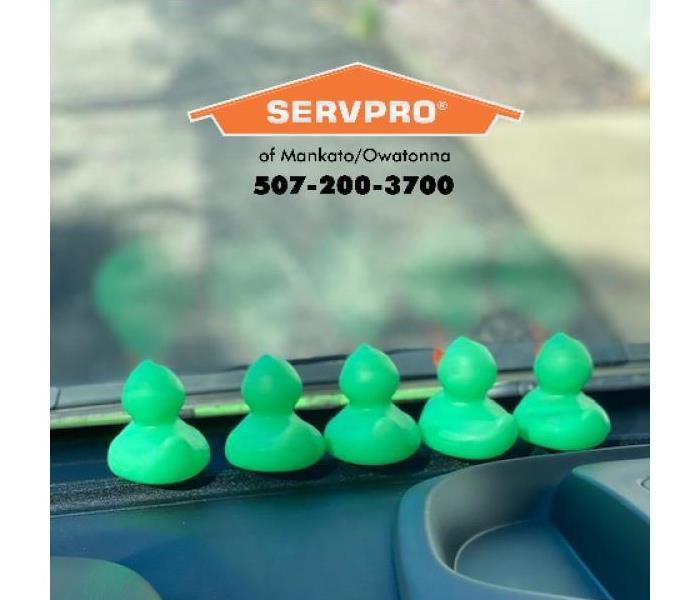 SERVPRO ducks sit on the dash of a van