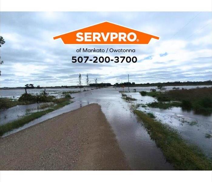 Flood waters block roads